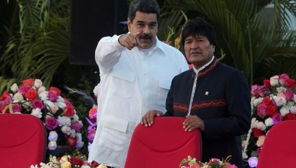 Venezuela's President Nicolas Maduro speaks with Bolivia's President Evo Morales during the swearing-in ceremony for the third term of Nicaragua's President Daniel Ortega at the revolution square in Managua, Nicaragua January 10,2017. 