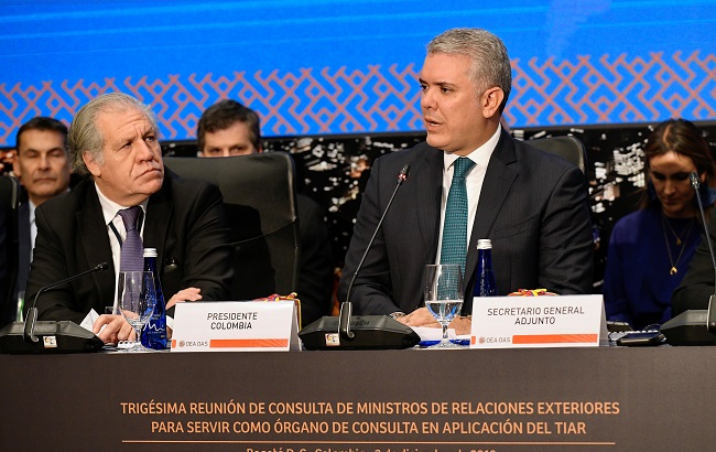 Colombia's President Ivan Duque speaks next to OAS General Secretary Luis Almagro, during a meeting of foreign ministers from countries that are signatories to the Inter-American Treaty of Reciprocal Assistance, known by its Spanish initials TIAR, in Bogota, Colombia December 3, 2019.