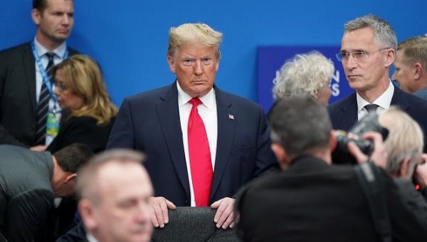 U.S. President Donald Trump stands among other leaders as he attends a North Atlantic Treaty Organization Plenary Session at the NATO summit in Watford, near London, Britain, December 4, 2019.