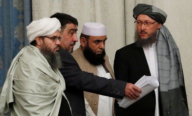 Members of the Taliban delegation take their seats during the multilateral peace talks on Afghanistan in Moscow, Nov. 9, 2018.