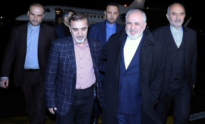 Iran's Foreign Minister Mohammad Javad Zarif walks with Iranian professor Massoud Soleimani as he arrives at Mehrabad airport, in Tehran, Iran December 7, 2019.
