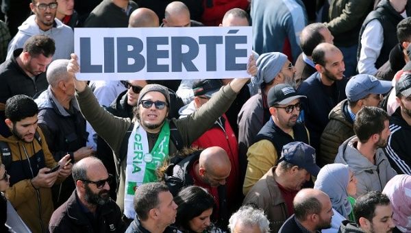 Demonstrators rejet the presidential election in Algiers, Algeria, Dec. 10, 2019. The banner reads, 'Freedom'.
