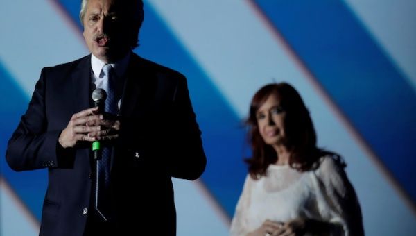 Argentina's President Alberto Fernandez speaks next to Vice President Cristina Fernandez de Kirchner on stage outside the Casa Rosada Presidential Palace after inauguration, in Buenos Aires, Argentina December 10, 2019. 
