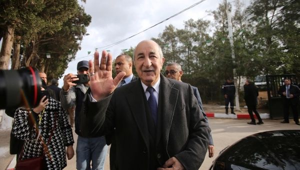 Presidential candidate Abdelmadjid Tebboune greets attendees during the election in Algiers, Algeria Dec. 12, 2019.