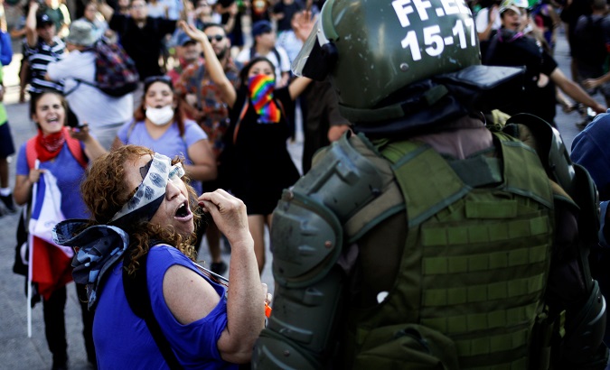 Citizen confronts a Military Police officer in Santiago, Chile, Dec. 9, 2019.