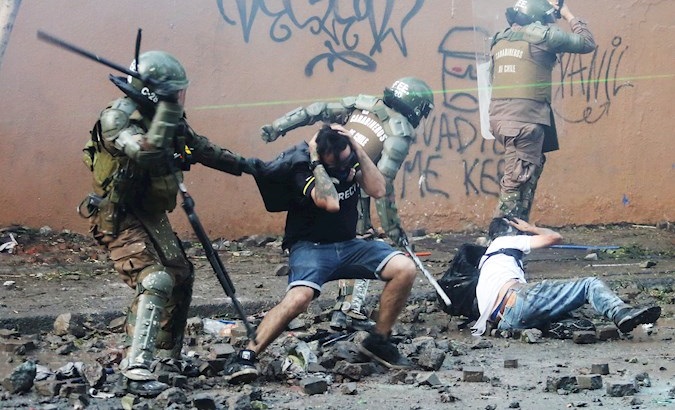 Military Police attacks citizens in the streets surrounding the place where the 'Concert for Dignity' was held in Santiago, Chile, Dec. 13, 2019.