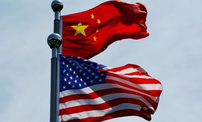 Chinese and U.S. flags flutter near The Bund, before U.S. trade delegation meet their Chinese counterparts for talks in Shanghai, China July 30, 2019.