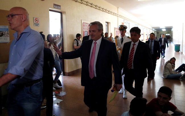 Argentina's President Alberto Fernandez (C) arrives prior to take an exam at the University of Buenos Aires Law School after taking office this week, in Buenos Aires, Argentina December 13, 2019.
