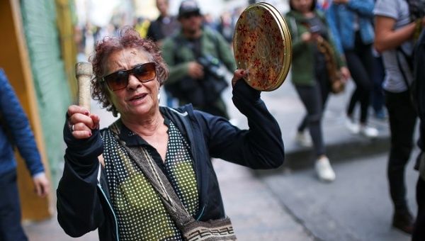 Woman takes part in a protest as a national strike continues in Bogota, Colombia Dec. 16, 2019.