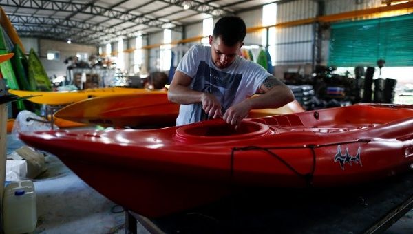 An employee works at the kayak factory in Buenos Aires, Argentina, Dec. 17, 2019. 