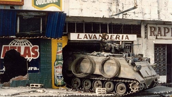 A U.S. Army M113 armored personnel carrier guards a street near the Panamanian Defense Force headquarters, Panama, Dec. 21, 1989.