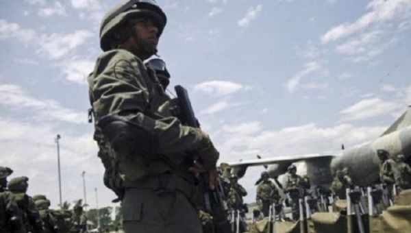 Venezuelan soldier stands guard.