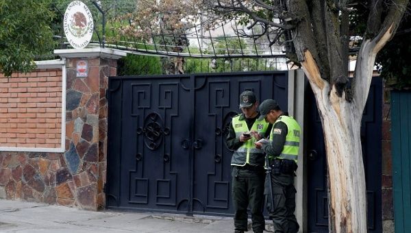 Policemen stand at the entrance of Mexico's embassy in La Paz, Bolivia, December 23, 2019.