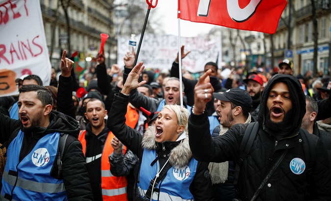 French workers on strike against Emmanuel Macron's pensions reform in Paris, France, Dec. 28, 2019.