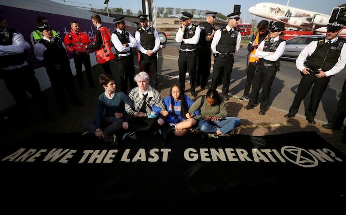 Climate change activists attend an Extinction Rebellion protest outside Heathrow Airport in London, Britain April 19, 2019.