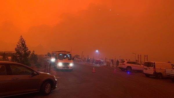 The sky glows red as bushfires continue to rage in Mallacoota, Victoria, Australia, Dec. 31, 2019.