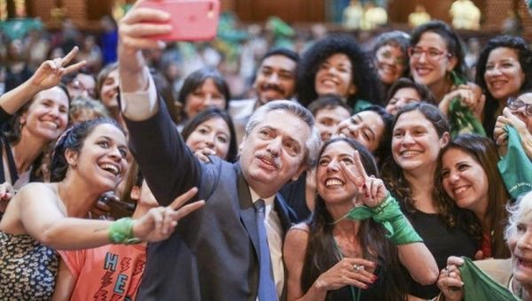 President Alberto Fernandez takes a selfie with women fighting for gender rights in Buenos Aires, Argentina, 2019.