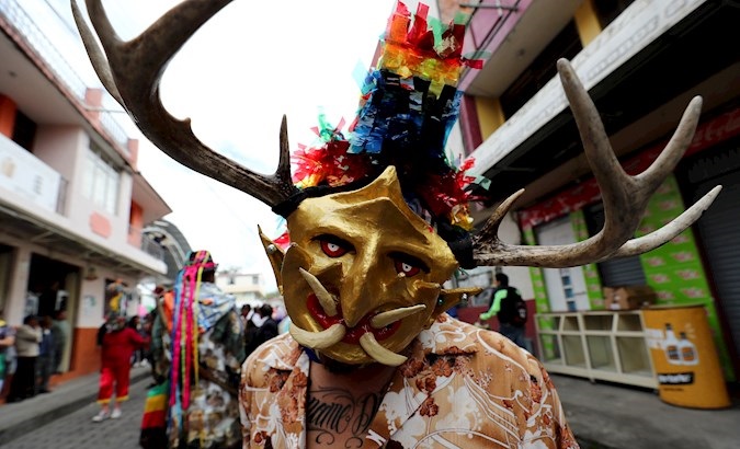 Person participating in the Dance of the Devils (La Diablada) in Pillaro, Ecuador, Dec. 3, 2020.