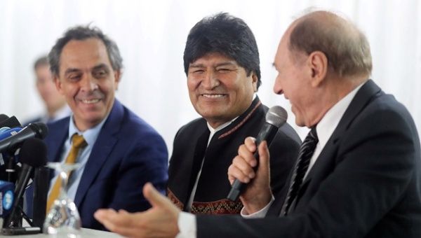 Former Bolivian President Evo Morales smiles next to Argentinian lawyer Gustavo Ferreyra, as Argentina's Former Supreme Court judge Eugenio Raul Zaffaroni speaks during a news conference, in Buenos Aires, Argentina January 2, 2020.