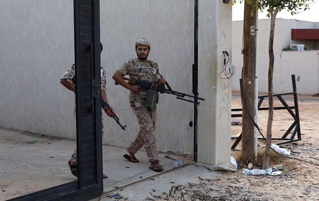 Members of Libya's internationally recognized government forces carry weapons in Ain Zara, Tripoli, Libya October 14, 2019. Picture taken October 14, 2019.