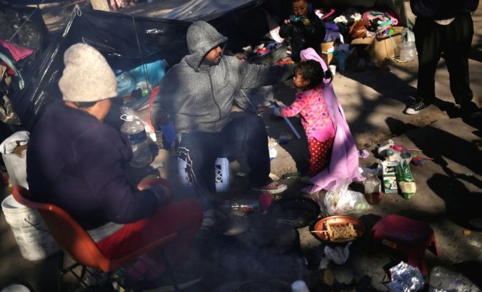 A Mexican family, who are fleeing from violence in their hometown and are currently camping near the Cordova-Americas international border crossing bridge while waiting to apply for asylum to the U.S. Dec.18, 2019.