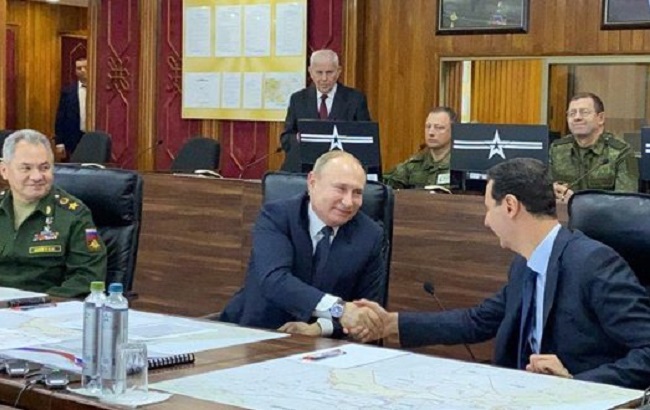 Russian President Vladimir Putin meets with Syrian President Bashar Al-Assad in Damascus.