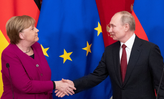 Russian President Vladimir Putin and German Chancellor Angela Merkel shake hands after a joint news conference in the Kremlin in Moscow, Russia, January 11, 2020.
