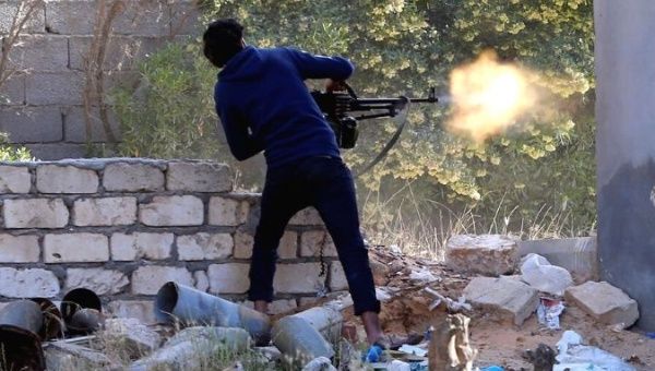 FILE PHOTO - A member of the Libyan internationally recognised government forces fires during a fight with Eastern forces in Ain Zara, Tripoli, Libya April 28, 2019.