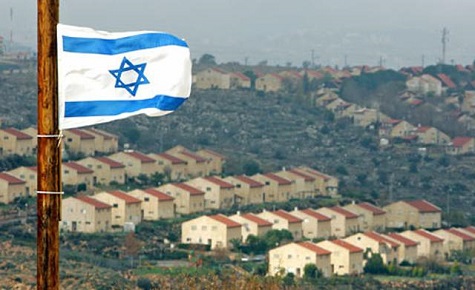 The Israeli flag flying over Israeli settlements in the West Bank.
