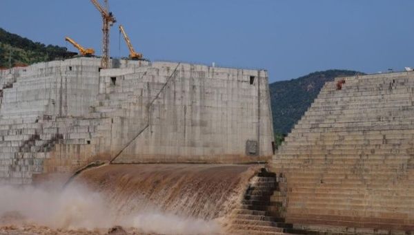 FILE PHOTO: Water flows through Ethiopia's Grand Renaissance Dam as it undergoes construction work on the river Nile in Guba Woreda, Benishangul Gumuz Region, Ethiopia September 26, 2019.