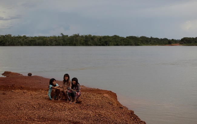 Children of the Kayapo tribe sit on the banks of Xingu River during a four-day pow wow in Piaracu village, in Xingu Indigenous Park, near Sao Jose do Xingu, Mato Grosso state, Brazil, January 15, 2020.