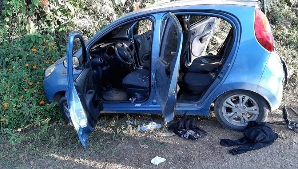 One of three vehicles attacked by armed men in the Jamundi municipality, Colombia, Jan. 16, 2020.