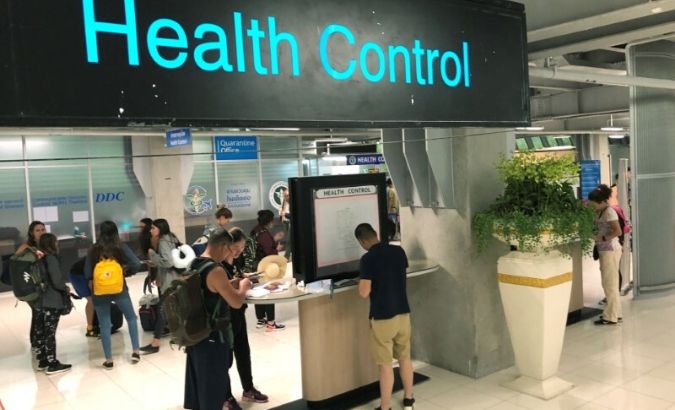 Tourist line-up in a health control at the arrival section at Suvarnabhumi international airport in Bangkok, Thailand, as countries have started screening incoming airline passengers from central China.