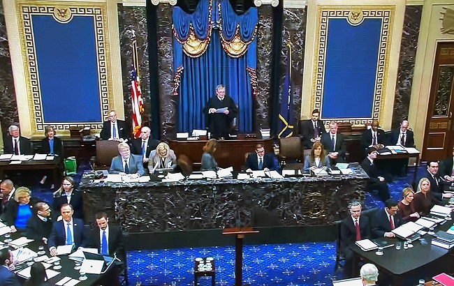 U.S. Supreme Court Chief Justice John Roberts presides over the start of the U.S. Senate impeachment trial of U.S. President Donald Trump as the House impeachment managers sit to one side and the president's legal team sits on the other side in this frame grab from video shot in the U.S. Senate Chamber at the U.S. Capitol in Washington, U.S., January 21, 2020.