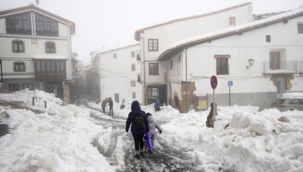 People walk during the Storm Gloria in Morella, Spain. 