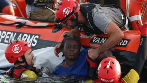Open Arms staff rescuing African migrants at the Mediterranean sea, Jan. 28, 2020.