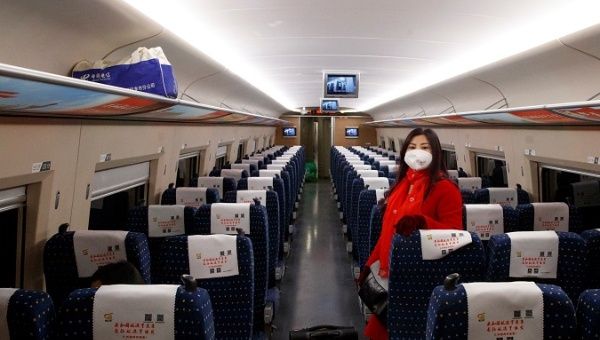 Woman travels on a high-speed train near Jiujiang, Jiangxi province, China, Jan. 29, 2020.