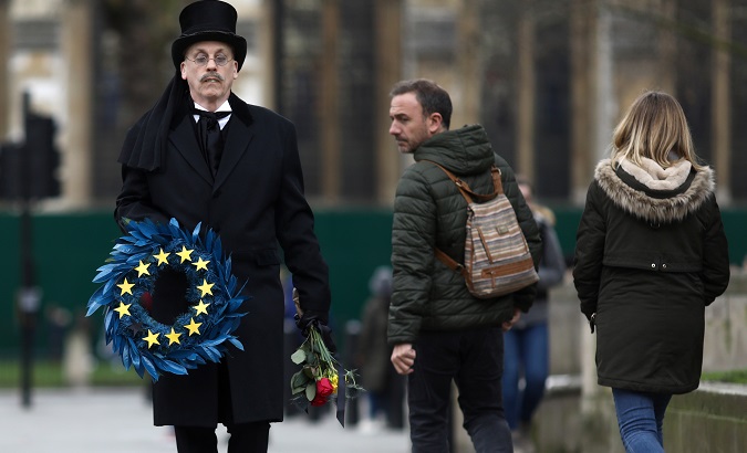A man carries an EU themed wreath at Parliament Square on Brexit day, London, UK, Jan. 31, 2020.