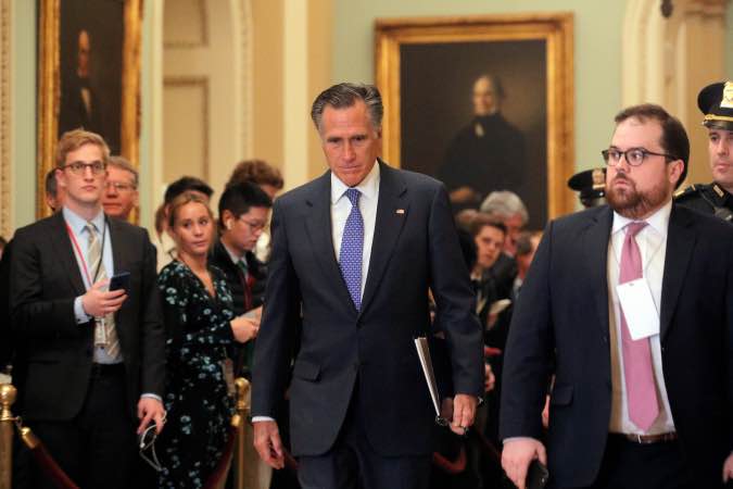 U.S. Senator Romney (R-UT) walks from Trump impeachment trial during recess on Capitol Hill in Washington