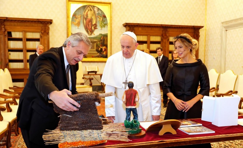 Pope Francis exchanges gifts with Argentina's President Alberto Fernandez during a private audience at the Vatican.