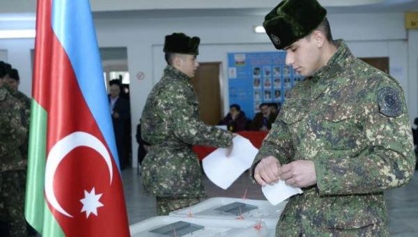 Azerbaijani soldiers cast their votes at a polling station in Baku, Azerbaijan, Feb. 9, 2020.