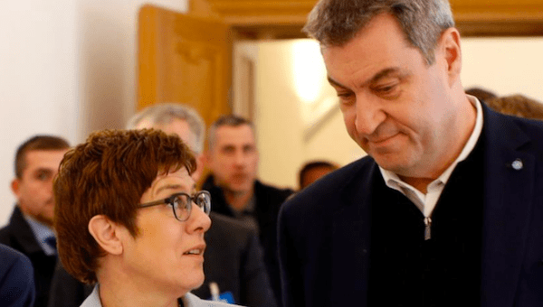 Bavarian State Premier Markus Soeder and German Defence Minister Annegret Kramp-Karrenbauer arrive at a news conference during a CSU party meeting at 