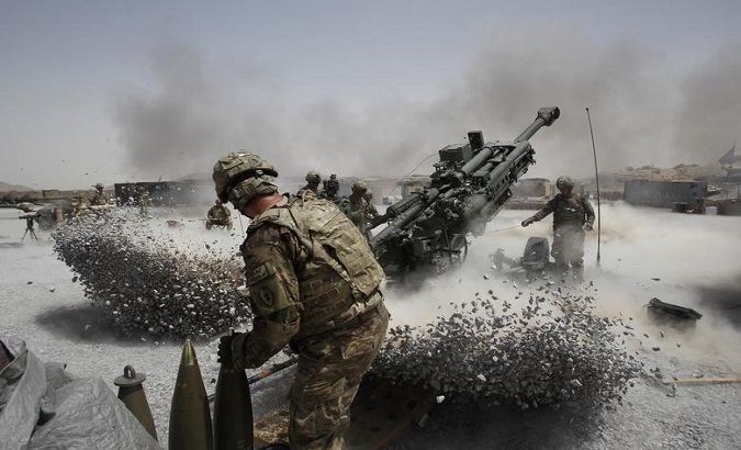 U.S. Army soldiers from the 2nd Platoon, B battery 2-8 field artillery, fire a howitzer artillery piece at Seprwan Ghar forward fire base in Panjwai district, Kandahar province southern Afghanistan, June 12, 2011.