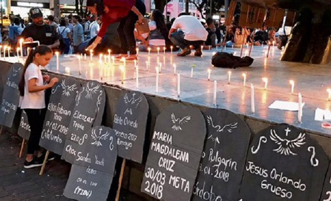 Citizens place candles to remember social leaders killed in Colombia, 2020.