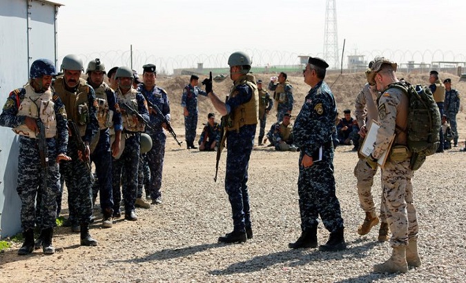 Iraqi federal policemen receive military instructions by Spanish military trainers during a course by NATO forces, at Basmaya military base, 65km southern Baghdad, Iraq, 12 March 2018.