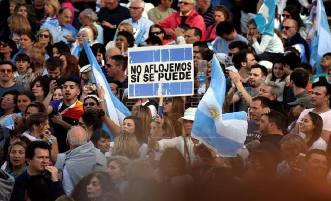 People participate in a march called by Argentine Former President Mauricio Macri in the Belgrano neighborhood of Buenos Aires, Argentina, on Sept. 28, 2019.