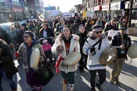 Supporters of the indigenous Wet'suwet'en Nation march as part of a protest against British Columbia's Coastal GasLink pipeline, in Toronto, Ontario.
