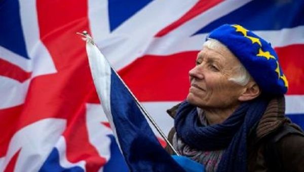 A woman holds a UK flag during a demonstration, London, U.K., January 2019.