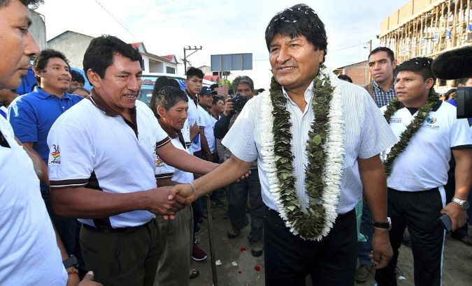 President Evo Morales (C) greets supporters before voting in Villa 14 de Septiembre, Bolivia, during the general elections on Oct. 20, 2019.