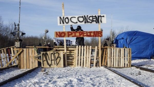 Supporters of the Wet'suwet'en who are against the LNG pipeline, block a Canadian National Railway line just west of Edmonton, Alberta, on Wednesday, Feb. 19, 2020.